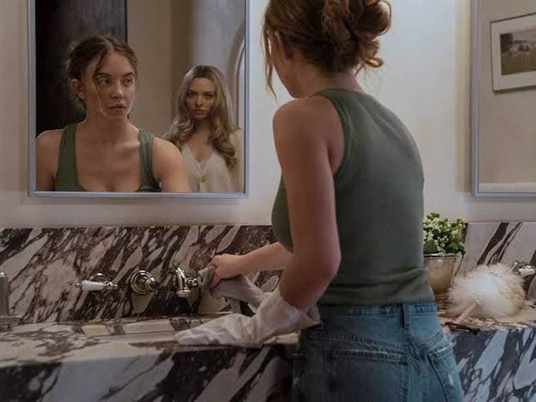 Dressed bathroom set with a marble vanity, mirror and framed art, styled by Olivia Peebles